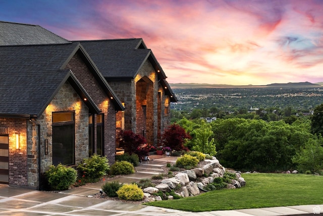 3196 E 25 S, Layton, UT 84040 - view of front of property with stone siding, roof with shingles, a front yard, and brick siding