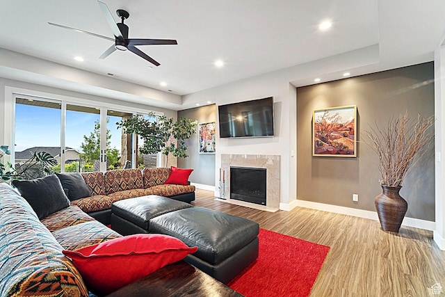 3196 E 25 S, Layton, UT 84040 - living room featuring wood finished floors, recessed lighting, baseboards, a fireplace, and a ceiling fan