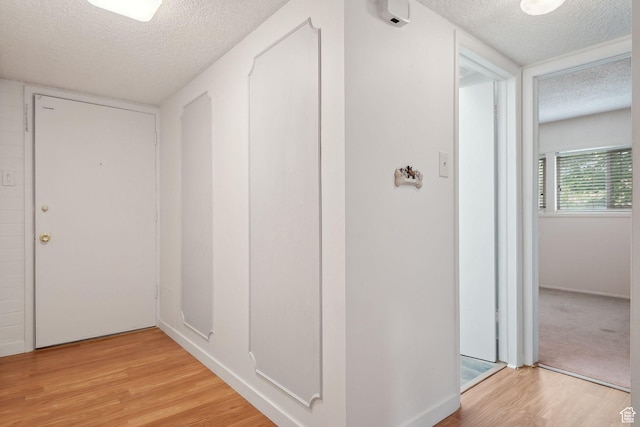 631 N 1200 W Unit A203, Salt Lake City, UT 84116 - hall with a textured ceiling and light wood finished floors