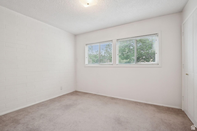 631 N 1200 W Unit A203, Salt Lake City, UT 84116 - empty room with light carpet and a textured ceiling