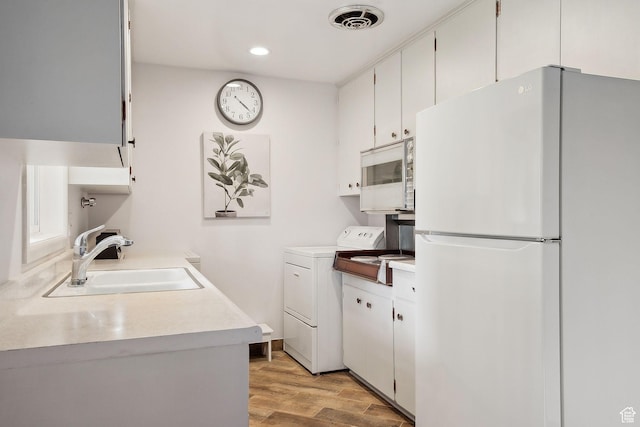 631 N 1200 W Unit A203, Salt Lake City, UT 84116 - washroom with light wood-type flooring, recessed lighting, and washing machine and dryer