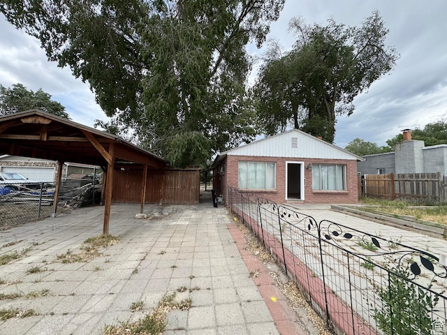 1666 W Warnock St S, Salt Lake City, UT 84119 - view of patio with fence and a carport