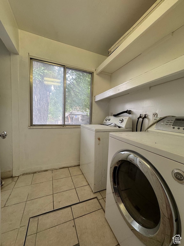 1666 W Warnock St S, Salt Lake City, UT 84119 - washroom with washing machine and clothes dryer and light tile patterned floors