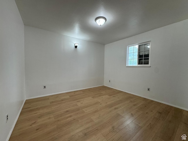 1666 W Warnock St S, Salt Lake City, UT 84119 - unfurnished room with light wood-type flooring and baseboards