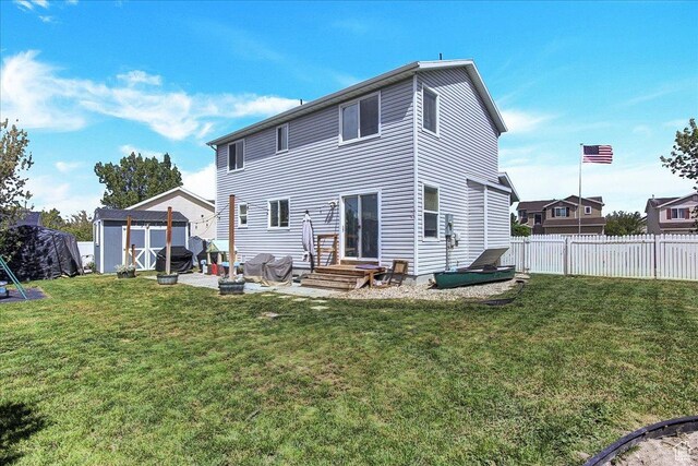 178 W Heidelberg Pl N, Stansbury Park, UT 84074 - back of property featuring a shed and an outbuilding