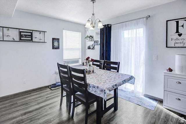 178 W Heidelberg Pl N, Stansbury Park, UT 84074 - dining space featuring a chandelier, wood finished floors, and plenty of natural light