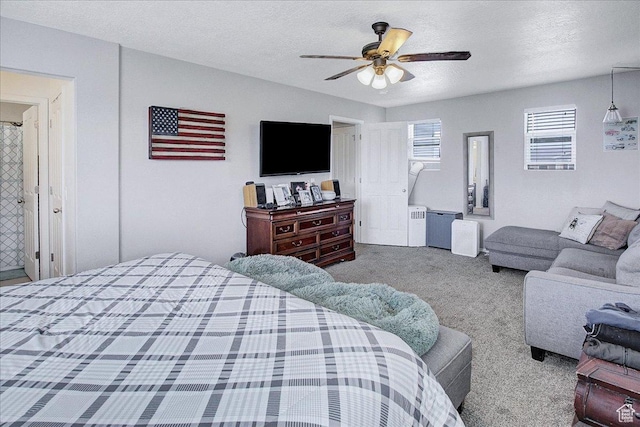 178 W Heidelberg Pl N, Stansbury Park, UT 84074 - bedroom with carpet flooring, a textured ceiling, and ceiling fan