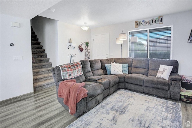 178 W Heidelberg Pl N, Stansbury Park, UT 84074 - living area with wood finished floors, stairs, and a textured ceiling