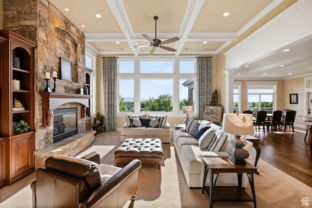 1515 E Maple St, Mapleton, UT 84664 - living room with a stone fireplace, recessed lighting, ceiling fan, wood finished floors, and crown molding