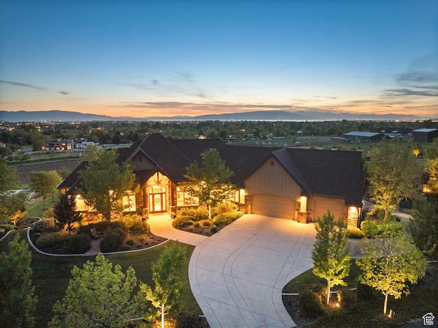 1515 E Maple St, Mapleton, UT 84664 - view of front facade with an attached garage, driveway, and stone siding