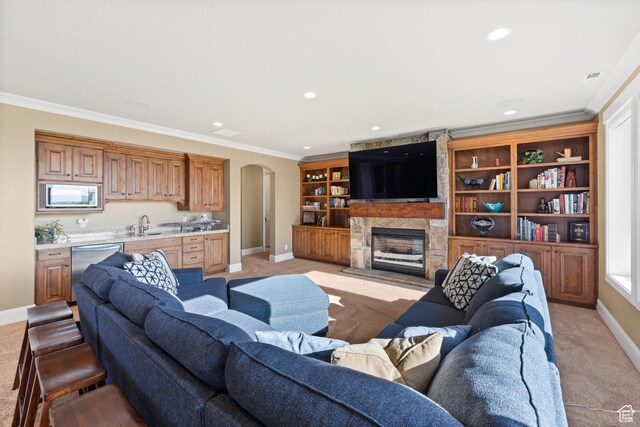 1515 E Maple St, Mapleton, UT 84664 - living area with light carpet, baseboards, arched walkways, crown molding, and recessed lighting