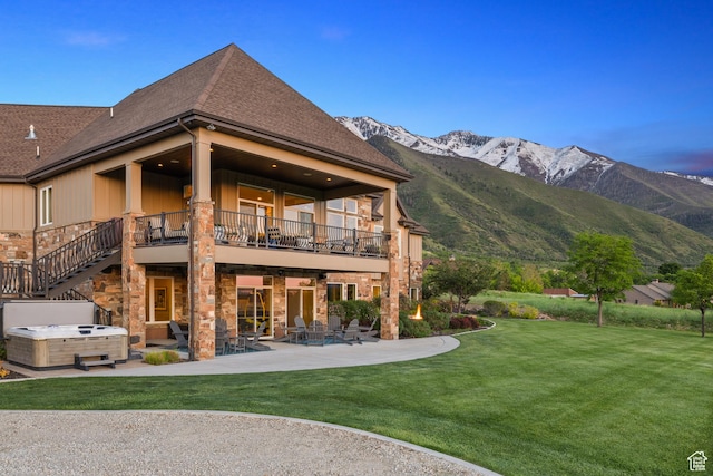 1515 E Maple St, Mapleton, UT 84664 - back of house featuring a hot tub, a patio, a balcony, a lawn, and a mountain view
