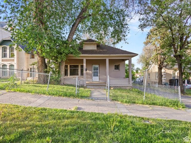 551 E 27th St, Ogden, UT 84403 - view of front facade featuring a porch and a gate