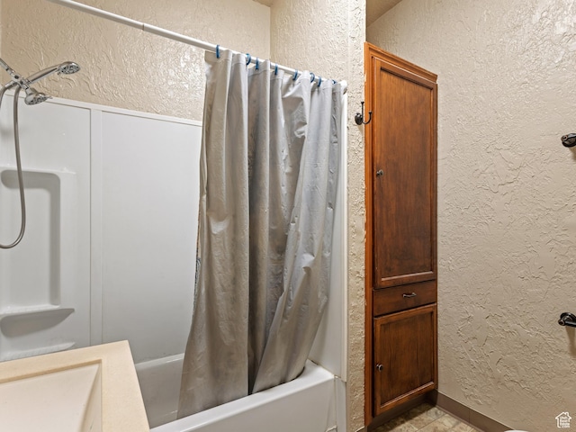 551 E 27th St, Ogden, UT 84403 - bathroom featuring a textured wall and shower / bath combo with shower curtain