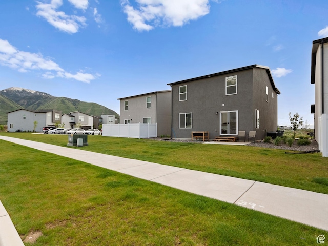 3957 S White Ash Dr, Mapleton, UT 84664 - rear view of house with a mountain view, stucco siding, and a residential view
