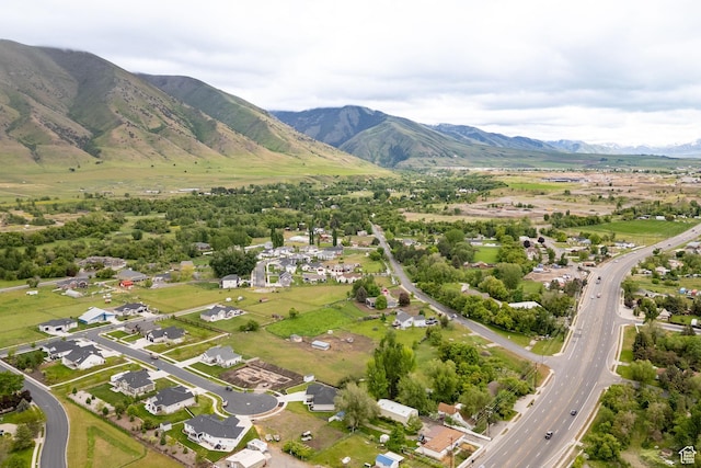 aerial overview of property's location with mountains and nearby suburban area