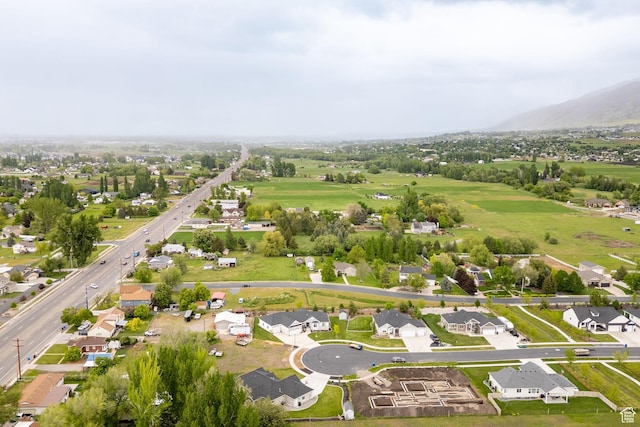 view of property location with a mountainous background and nearby suburban area