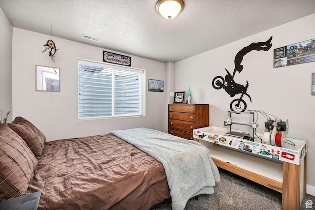 carpeted bedroom with a textured ceiling