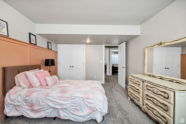 bedroom with light colored carpet and a closet