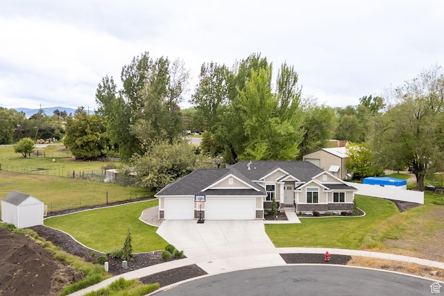 view of front of property with a garage and driveway