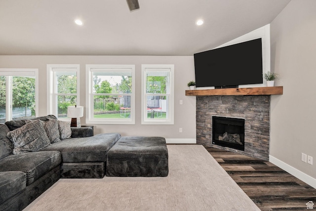 living area with healthy amount of natural light, baseboards, wood finished floors, vaulted ceiling, and recessed lighting