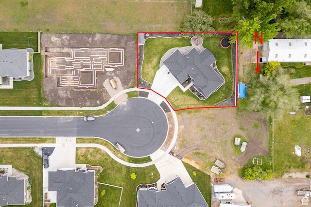 aerial view of property and surrounding area with property parcel outlined