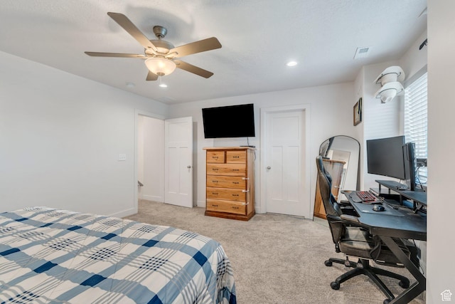 bedroom featuring light colored carpet, recessed lighting, a desk, a ceiling fan, and baseboards