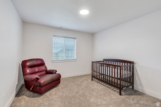 carpeted bedroom with baseboards