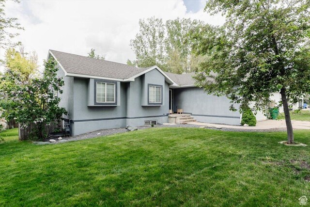 375 S 900 E, Smithfield, UT 84335 - ranch-style home featuring a front yard, a shingled roof, and stucco siding