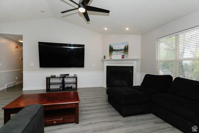 375 S 900 E, Smithfield, UT 84335 - living room with a ceiling fan, wood finished floors, vaulted ceiling, a fireplace, and recessed lighting