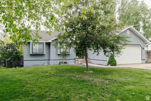 375 S 900 E, Smithfield, UT 84335 - view of front of property with a garage, a front yard, concrete driveway, roof with shingles, and stucco siding