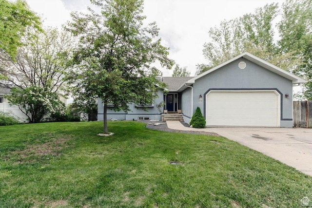 375 S 900 E, Smithfield, UT 84335 - ranch-style home with an attached garage, concrete driveway, a front yard, stucco siding, and entry steps