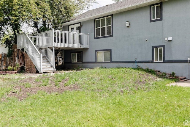 375 S 900 E, Smithfield, UT 84335 - rear view of house with stairway, a wooden deck, stucco siding, and a lawn