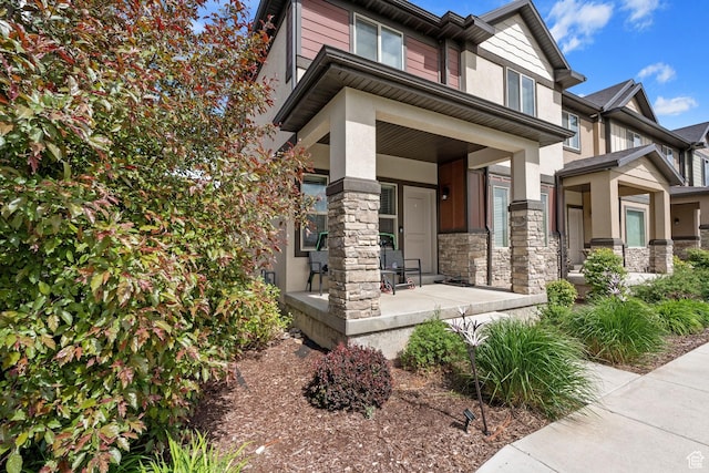 715 N 2560 E, Spanish Fork, UT 84660 - view of front of property with a porch, stucco siding, and stone siding
