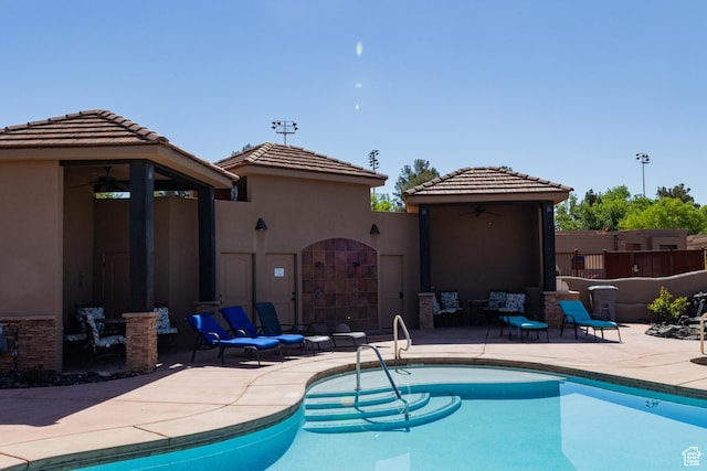 2090 N Tuweap Dr Unit 15, St George, UT 84770 - view of swimming pool featuring ceiling fan, a patio area, and a gazebo
