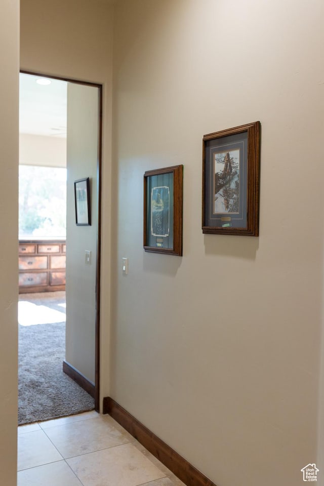 2090 N Tuweap Dr Unit 15, St George, UT 84770 - hall with light colored carpet, light tile patterned floors, and baseboards