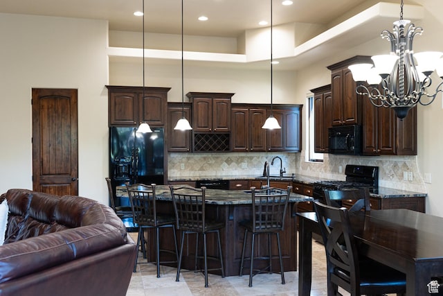 2090 N Tuweap Dr Unit 15, St George, UT 84770 - kitchen featuring black appliances, a sink, dark brown cabinetry, a chandelier, and recessed lighting