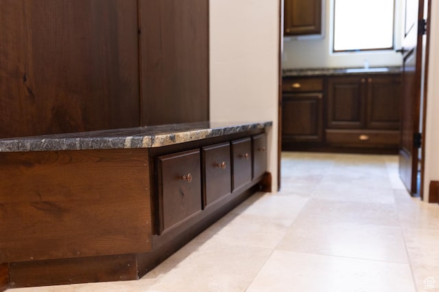 2090 N Tuweap Dr Unit 15, St George, UT 84770 - kitchen featuring dark brown cabinets, light flooring, and dark countertops