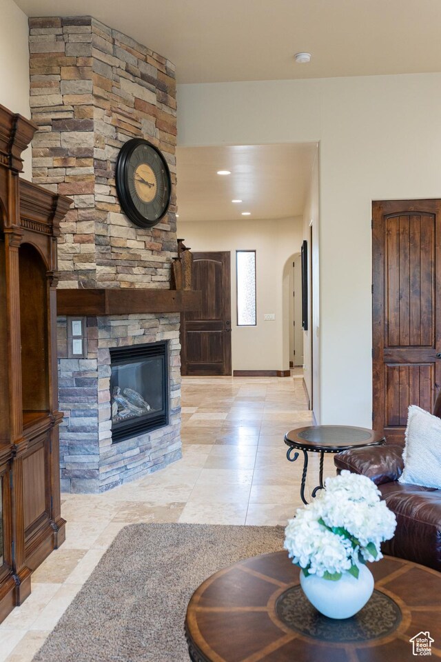 2090 N Tuweap Dr Unit 15, St George, UT 84770 - living room with light tile patterned floors and a stone fireplace