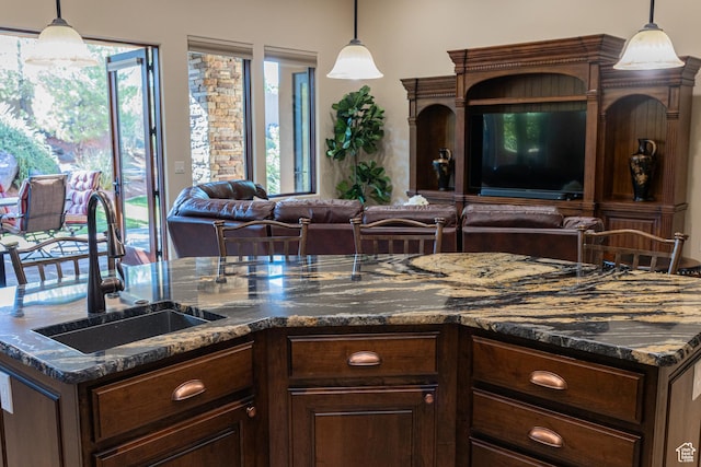 2090 N Tuweap Dr Unit 15, St George, UT 84770 - kitchen with a sink, open floor plan, plenty of natural light, and decorative light fixtures