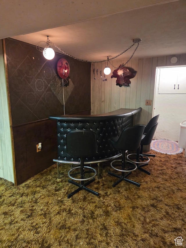 157 E 100 N, Wellington, UT 84542 - dining room featuring a dry bar, wooden walls, and carpet