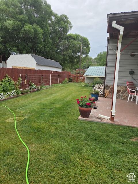 157 E 100 N, Wellington, UT 84542 - fenced backyard featuring a patio area