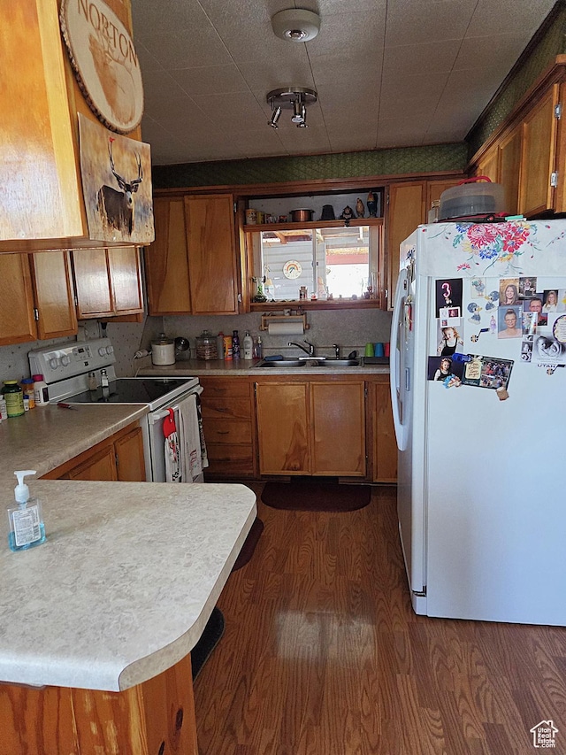 157 E 100 N, Wellington, UT 84542 - kitchen with white appliances, brown cabinets, and light countertops