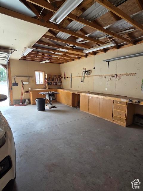 157 E 100 N, Wellington, UT 84542 - garage featuring a workshop area