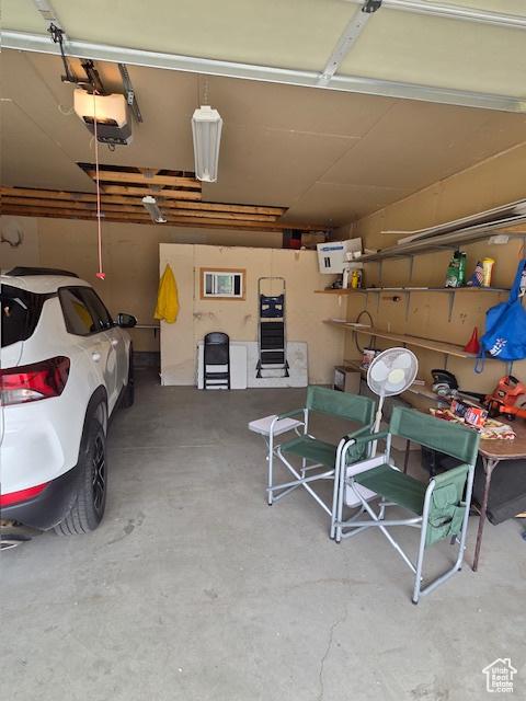 157 E 100 N, Wellington, UT 84542 - garage featuring a garage door opener