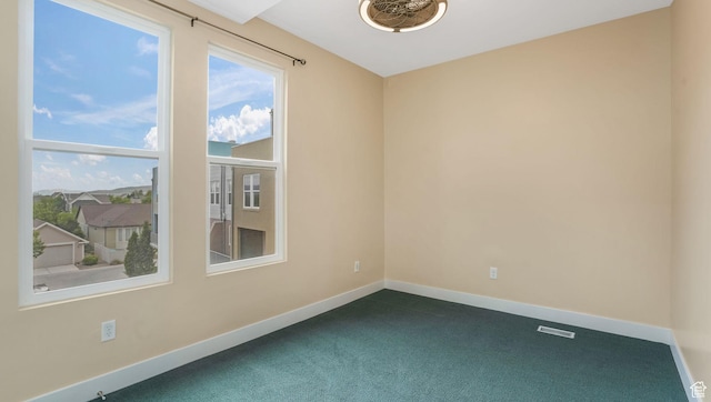 4955 W Daybreak Pkwy, South Jordan, UT 84009 - spare room with dark carpet and baseboards