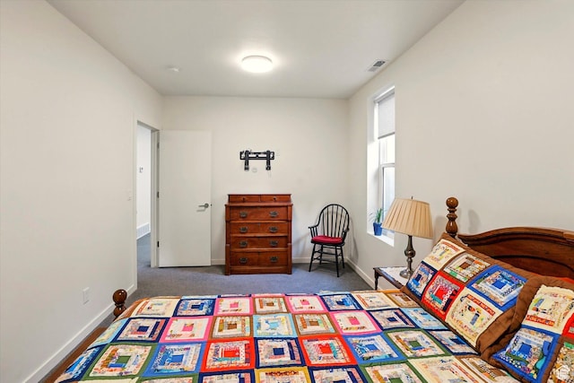 carpeted bedroom with baseboards
