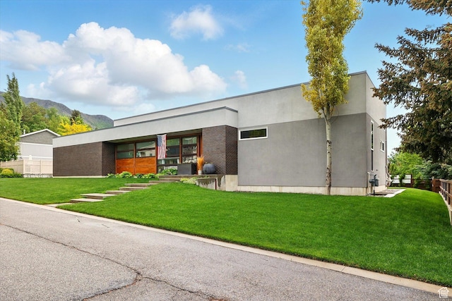 view of front of house with a mountain view and stucco siding