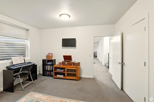 carpeted office space with baseboards