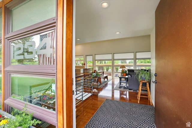 hall with recessed lighting and wood finished floors